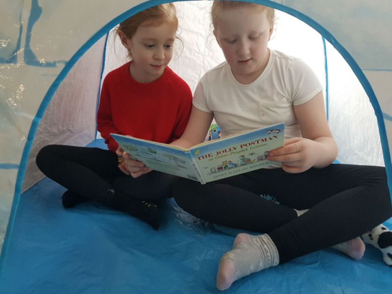 Enjoying The Jolly Postman in the igloo.