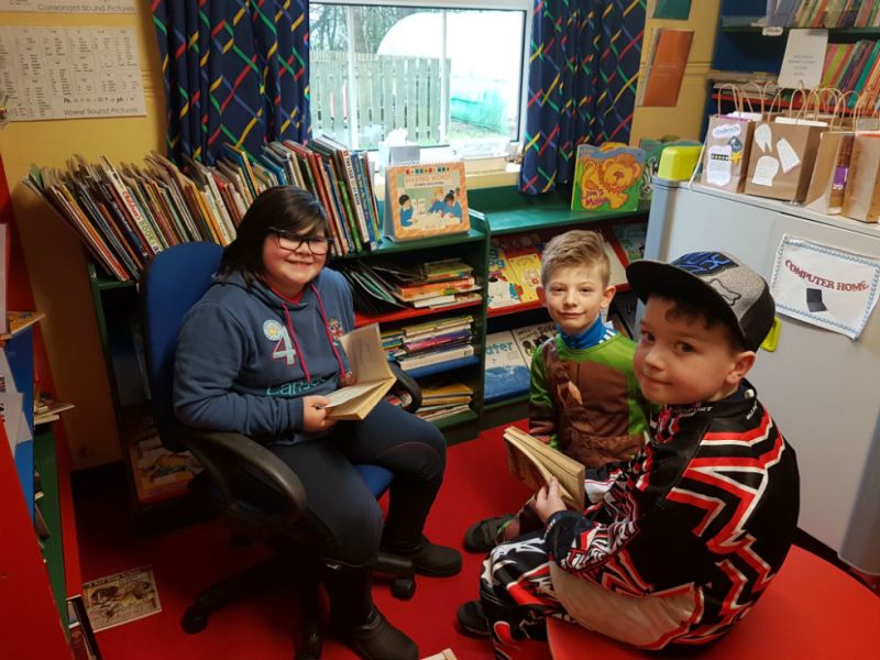 Reading a Goosebumps story in the library.