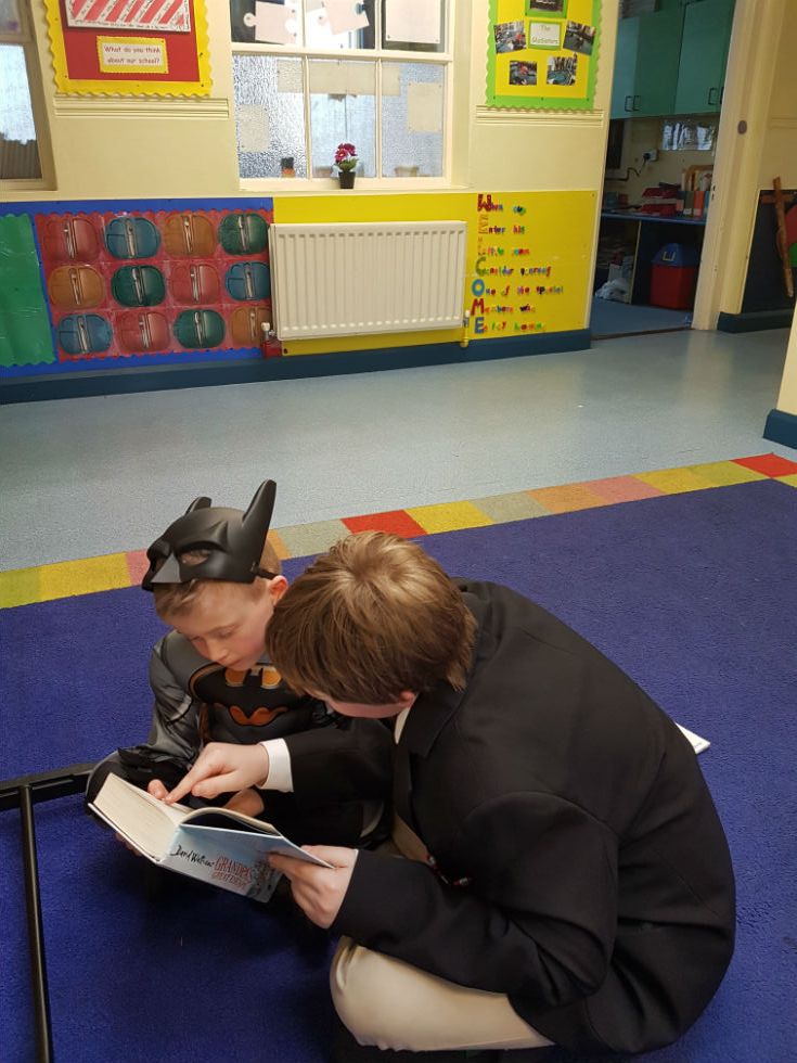 Using your finger to help guide a younger reader.